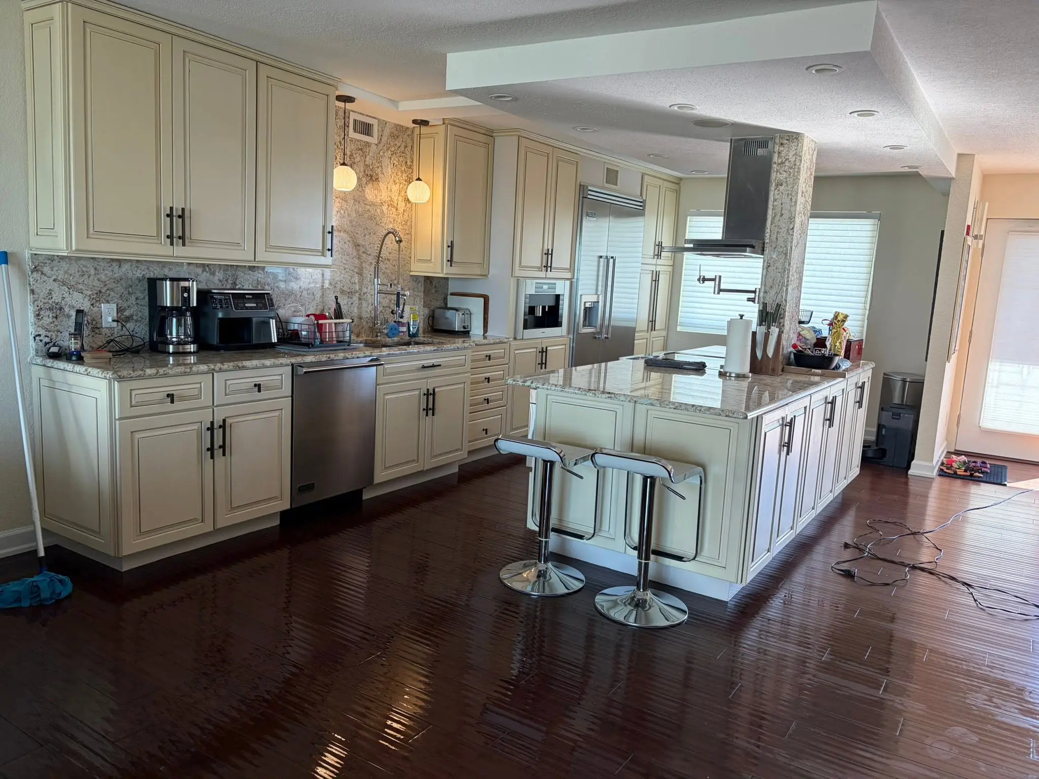 Polished kitchen island with clean stools after residential cleaning in Palm Harbor